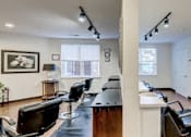 Thumbnail 6 of 11 - a living room with a bar and chairs and a table at Windsor Crossing Senior, Suitland, 20746 