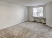 Thumbnail 2 of 11 - an empty room with white walls and floors and a window at Windsor Crossing Senior, Suitland Maryland 
