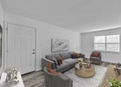 Thumbnail 4 of 15 - A living room with a grey couch and a coffee table.