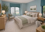 Thumbnail 6 of 10 - A bedroom with a large bed, a chair, a nightstand, and a table with a plant on it.
