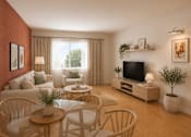 Thumbnail 5 of 10 - A living room with a television, a sofa, a coffee table, and a potted plant.