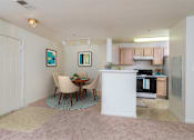 Thumbnail 5 of 32 - interior dining room and kitchen with oven, dining room table, and chairs at Governors Green, Bowie, MD, 20716