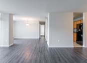 Thumbnail 23 of 29 - A spacious room with wooden flooring and white walls at Charlestowne North Apartments, Maryland, 20770