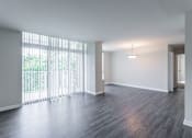 Thumbnail 22 of 29 - A room with a large window and wooden flooring at Charlestowne North Apartments, Maryland