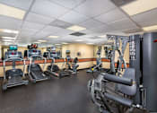 Thumbnail 8 of 29 - A gym with treadmills, exercise bikes, and other equipment at Charlestowne North Apartments, Greenbelt, Maryland