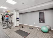 Thumbnail 41 of 49 - Gym room with variety of equipment, weight rack and exercise balls at Columbia Pointe, Columbia, MD, Maryland 