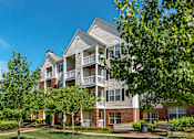 Thumbnail 31 of 32 - exterior with a tree-lined sidewalk at Governors Green, Bowie, 20716