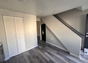 Thumbnail 2 of 3 - A room with a staircase leading to the upper floor at Pleasantview Apartments, Baltimore, MD, 21214