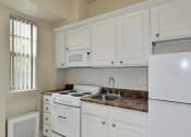 Thumbnail 16 of 30 - Kitchen With White Cabinetry And Appliances at Majestic, Washington