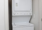 Thumbnail 3 of 9 - a white washer and dryer in a white room at Overland Gardens, Landover, 20785 