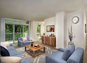 Thumbnail 14 of 29 - A living room with a blue sofa, a wooden coffee table, and a large window with a view of trees at Charlestowne North Apartments, Maryland, 20770