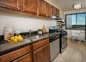 Thumbnail 5 of 18 - wood cabinets and granite countertops at Colesville Towers Apartments, Silver Spring, Maryland