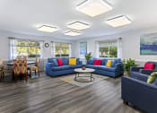 Thumbnail 6 of 15 - community space at Creekside at Taskers Chance in Frederick, MD  with blue couches, chairs and a coffee table
