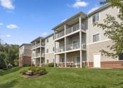 Thumbnail 8 of 15 - exterior of Creekside at Taskers Chance in Frederick, MD  with focus on white railings and grass