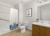 Thumbnail 4 of 15 - bathroom at Creekside at Taskers Chance in Frederick, MD with wood vanity with white countertops, white tub, tan tile floor and mirror with vanity lights