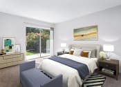 Thumbnail 3 of 15 - bedroom at Creekside at Taskers Chance in Frederick, MD with bed with white and blue linens, bedroom bench, nighttables and dresser