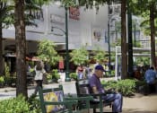 Thumbnail 11 of 14 - Man Sitting In A Park at Metro 710, Silver Spring