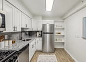 Thumbnail 11 of 49 - White Cabinetry And Appliances In Kitchen at Columbia Pointe, Maryland 