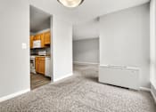 Thumbnail 28 of 41 - A white room with a white appliance and a white wall.