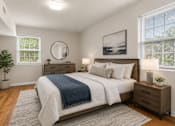 Thumbnail 2 of 37 - Furnished bedroom with modern wood furniture at University Landing Apartments, Silver Spring