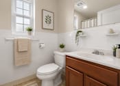 Thumbnail 4 of 37 - Bathroom with subway tile and wood vanity cabinet at University Landing Apartments, Maryland, 20903