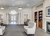 Thumbnail 13 of 17 - a waiting room with chairs and a table and a window at Windsor Crossing, Suitland 