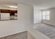 Thumbnail 16 of 17 - An empty apartment with bright windows at Windsor Crossing, Suitland, MD 