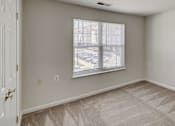 Thumbnail 5 of 17 - an empty room with white walls and a window at Windsor Crossing, Suitland, 20746 