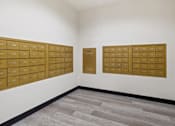 Thumbnail 13 of 29 - A room with a white wall and a grey floor with a brown board on the wall.