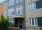 Thumbnail 1 of 14 - a picture of the front of the building