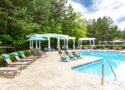 Thumbnail 28 of 48 - pool with cabana and lounge chairs at Brodick Hill, Lithia Springs, 30122