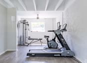 Thumbnail 8 of 17 - A treadmill is in a room with a window.