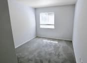 Thumbnail 7 of 13 - an empty room with a window and white walls at Retreat at Savannah, Savannah, GA, 31404