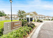 Thumbnail 20 of 21 - The image shows a sign for Faris located at the entrance of a residential area.