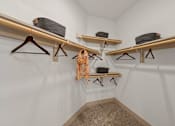 Thumbnail 18 of 44 - A room with three shelves and a carpeted floor.