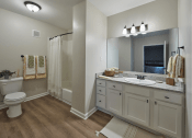Thumbnail 2 of 14 - a bathroom with a sink and a toilet and a shower