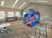 Thumbnail 9 of 14 - an activity room with games and tables at the preserve at greatstone