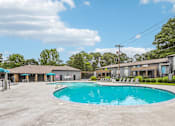Thumbnail 31 of 37 - A large swimming pool in the middle of a parking lot.