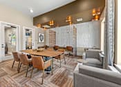 Thumbnail 26 of 44 - A modern dining room with a wooden table and chairs.