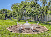 Thumbnail 13 of 15 - a patio with a table and chairs in the grass