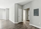 Thumbnail 8 of 14 - A room with a white door and a window with a view of a fence.