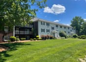 Thumbnail 17 of 20 - Exterior with greenery at Coach House, Massachusetts, 01824