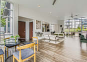 Thumbnail 10 of 27 - A modern office space with wooden floors and furniture.