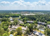 Thumbnail 2 of 18 - an aerial view of a park with buildings and trees