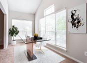 Thumbnail 15 of 37 - a home office with a large window and a large potted plant  at Avenues of Kennesaw East & West, Kennesaw, GA