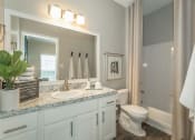 Thumbnail 9 of 37 - a bathroom with vanity at avenues of kennesaw  at Avenues of Kennesaw East & West, Kennesaw, GA