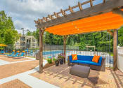 Thumbnail 18 of 37 - a lounge by the pool at avenues of kennesaw at Avenues of Kennesaw East & West, Kennesaw