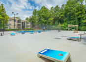 Thumbnail 24 of 37 - gaming center with cornhole boards at avenues of kennesaw at Avenues of Kennesaw East & West, Kennesaw, 30144