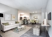 Thumbnail 5 of 48 - 2 bedroom model living room with couch at Brodick Hill, Lithia Springs, GA, 30122