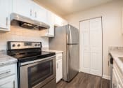 Thumbnail 8 of 37 - model apartment kitchen with stainless steel appliances at Palmetto Place, Fort Mill, 29708
